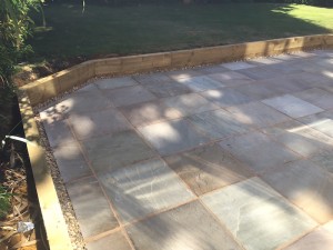 Natural stone with retaining sleeper walls