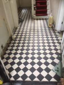 Traditional individual Victorian encaustic tiles laid in a diamond pattern