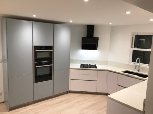 Quartz worktops with under mounted composite sink & pop up USB socket banks