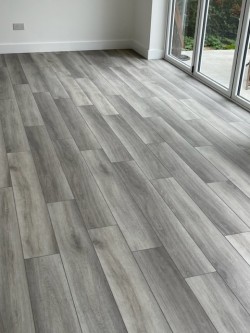 Luxury Vinyl textured mid grey oak with micro bevelled edge.