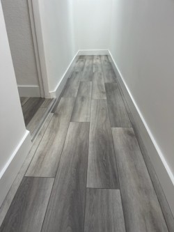 Luxury Vinyl textured mid grey oak with micro bevelled edge.