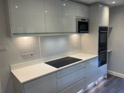 Quartz worktops / splashbacks incorporating under – cupboard & plinth L.E.D lighting