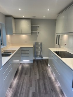 Quartz worktops / splashbacks incorporating under – cupboard & plinth L.E.D lighting